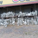 Concrete garden statues and figurines displayed outside booths 332, 333, 334, 336, and 337 at Jockey Lot – June 2025 Vendor of the Month